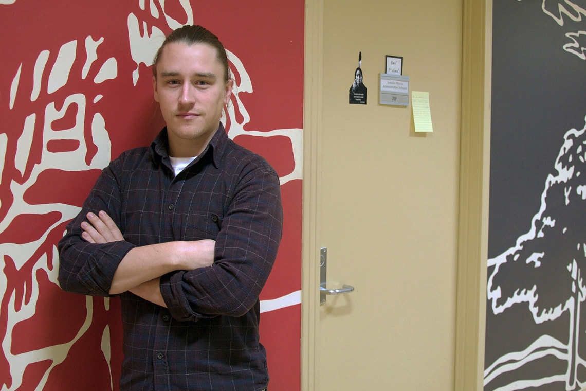 A portrait photo of Professor Ryan DeCaire, taken in the Centre for Indigenous Studies