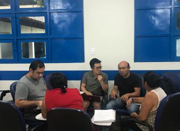 Gregory Antono, centre, works with speakers of Macuxi, an Indigenous language spoken in the area between Brazil and Guyana